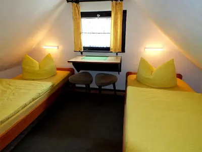 Ein Bett oder Betten in einem Zimmer der Unterkunft Ferienwohnungen Schrot