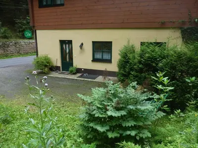 Ein Garten an der Unterkunft Ferienwohnung UHU neben der Schrammsteinbaude