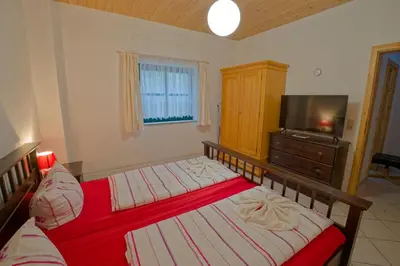 Ein Bett oder Betten in einem Zimmer der Unterkunft Ferienwohnung UHU neben der Schrammsteinbaude