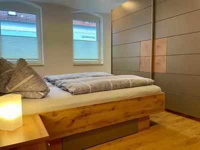 Ein Bett oder Betten in einem Zimmer der Unterkunft STADTOASE moderne Wohnungen mit Balkon, Komfort und Ruhe, Für Monteure geeignet, Free WiFi