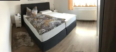 Ein Bett oder Betten in einem Zimmer der Unterkunft Am Tor zur Sächsischen Schweiz