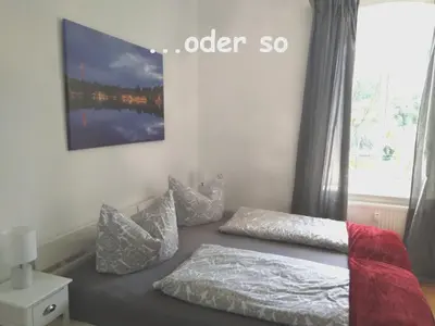 Ein Bett oder Betten in einem Zimmer der Unterkunft Ferienwohnung Paula
