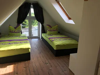 Ein Bett oder Betten in einem Zimmer der Unterkunft FeWo Altwahnsdorf