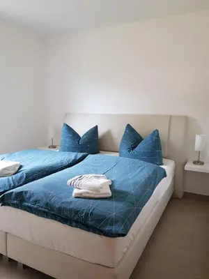 Ein Bett oder Betten in einem Zimmer der Unterkunft Ferienwohnung Fischer