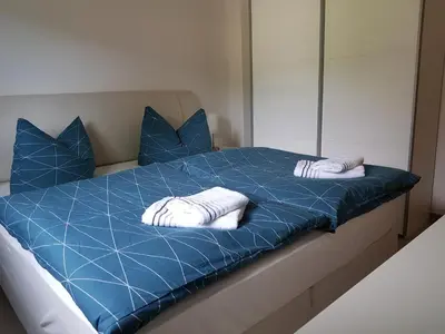Ein Bett oder Betten in einem Zimmer der Unterkunft Ferienwohnung Fischer