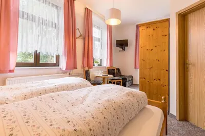 Ein Bett oder Betten in einem Zimmer der Unterkunft Hotel Carola