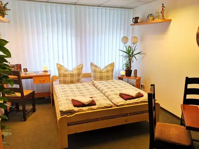 Ein Bett oder Betten in einem Zimmer der Unterkunft Gästezimmer Am Gewölbekeller