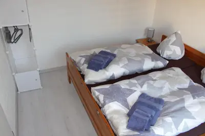Ein Bett oder Betten in einem Zimmer der Unterkunft Ferienwohnung Rolle