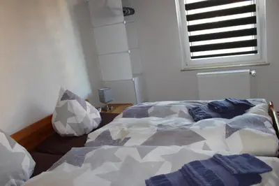 Ein Bett oder Betten in einem Zimmer der Unterkunft Ferienwohnung Rolle