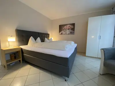 Ein Bett oder Betten in einem Zimmer der Unterkunft Gästehaus Matthias