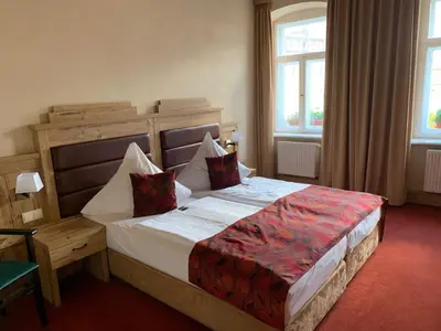 Ein Bett oder Betten in einem Zimmer der Unterkunft Hotel Goldner Löwe