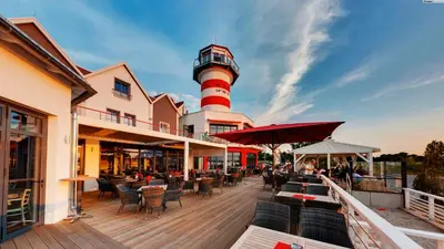Ein Restaurant oder anderes Speiselokal in der Unterkunft Der LeuchtTurm-Gastro GmbH