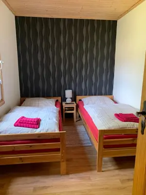 Ein Bett oder Betten in einem Zimmer der Unterkunft Pension Lausa