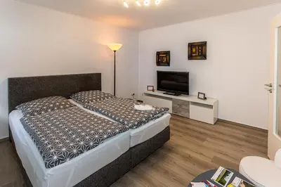 Ein Bett oder Betten in einem Zimmer der Unterkunft Ferienwohnungen am Markt - Der Sachsenhof