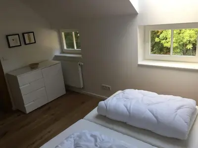 Ein Bett oder Betten in einem Zimmer der Unterkunft Gästewohnung am Museum