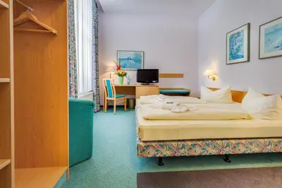 Ein Bett oder Betten in einem Zimmer der Unterkunft Hotel Alte Klavierfabrik Meißen