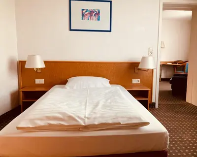 Ein Bett oder Betten in einem Zimmer der Unterkunft Akzent Congresshotel Hoyerswerda