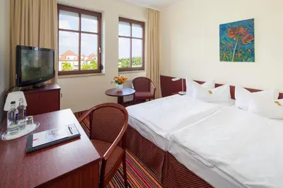 Ein Bett oder Betten in einem Zimmer der Unterkunft Kim Hotel Dresden