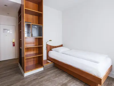 Ein Bett oder Betten in einem Zimmer der Unterkunft DORMERO Hotel Dresden Airport