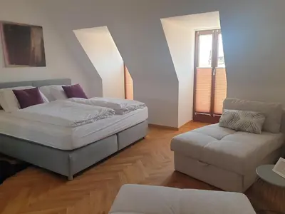 Ein Bett oder Betten in einem Zimmer der Unterkunft Modernes Apartment an der Frauenkirche