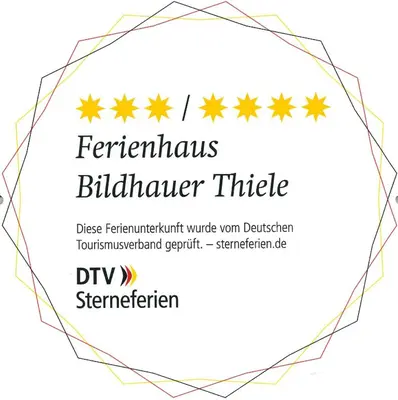 Ein Zertifikat, Auszeichnung, Logo oder anderes Dokument, das in der Unterkunft Ferienhaus Bildhauer Thiele ausgestellt ist
