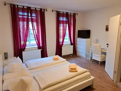 Ein Bett oder Betten in einem Zimmer der Unterkunft Gästehaus Villa Seraphinum