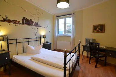 Ein Bett oder Betten in einem Zimmer der Unterkunft Gästehaus Villa Seraphinum