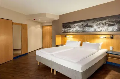 Ein Bett oder Betten in einem Zimmer der Unterkunft Amedia Dresden Elbpromenade, Trademark Collection by Wyndham
