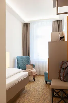 Ein Sitzbereich in der Unterkunft Hotel Ross