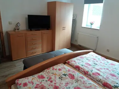 Ein Bett oder Betten in einem Zimmer der Unterkunft Ferienwohnung auf dem Land