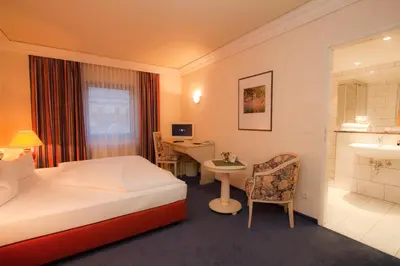 Ein Bett oder Betten in einem Zimmer der Unterkunft Hotel Weißes Roß