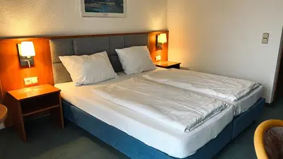 Ein Bett oder Betten in einem Zimmer der Unterkunft Hotel Siebeneichen