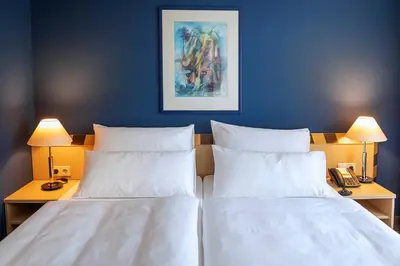 Ein Bett oder Betten in einem Zimmer der Unterkunft ACHAT Hotel Dresden Elbufer