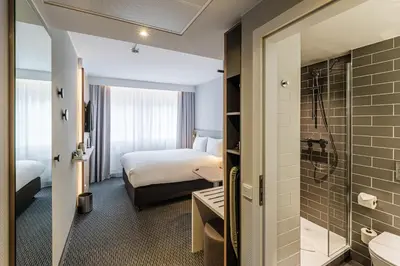 Ein Bett oder Betten in einem Zimmer der Unterkunft Holiday Inn Express Dresden Zentrum by IHG