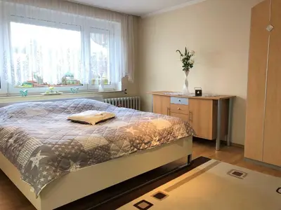 Ein Bett oder Betten in einem Zimmer der Unterkunft Ferienhaus am Wiesenweg