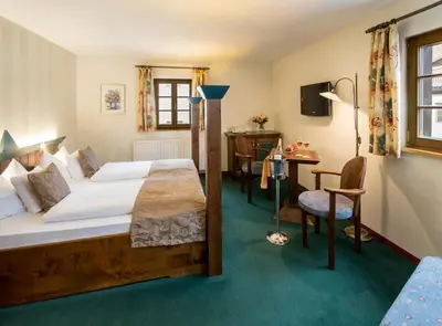 Ein Bett oder Betten in einem Zimmer der Unterkunft Hotel Saigerhütte