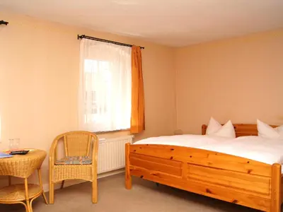 Ein Bett oder Betten in einem Zimmer der Unterkunft Alt Coswigerhof