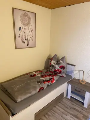 Ein Bett oder Betten in einem Zimmer der Unterkunft Zimmervermietung Graupner
