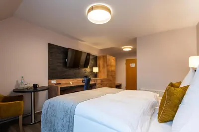 Ein Bett oder Betten in einem Zimmer der Unterkunft AKZENT Hotel Frankenberg