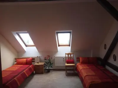 Ein Bett oder Betten in einem Zimmer der Unterkunft Spiegelland - Zuhause für Mitarbeiter