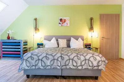 Ein Bett oder Betten in einem Zimmer der Unterkunft Hotel Zur Waldhufe