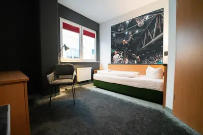 Ein Bett oder Betten in einem Zimmer der Unterkunft Feel Good Hotel