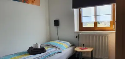 Ein Bett oder Betten in einem Zimmer der Unterkunft Alte Post zu Stetzsch