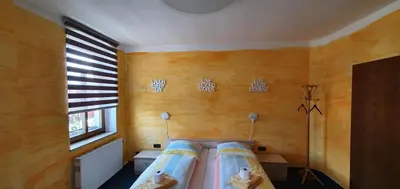 Ein Bett oder Betten in einem Zimmer der Unterkunft Alte Post zu Stetzsch