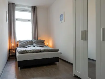 Ein Bett oder Betten in einem Zimmer der Unterkunft Moderne City Appartments im Stadtzentrum
