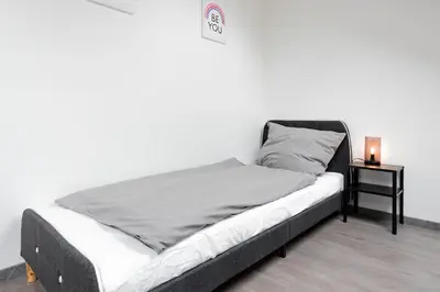 Ein Bett oder Betten in einem Zimmer der Unterkunft Moderne City Appartments im Stadtzentrum
