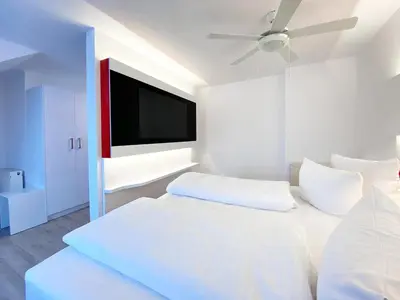 Ein Bett oder Betten in einem Zimmer der Unterkunft DORMERO Hotel Hoyerswerda