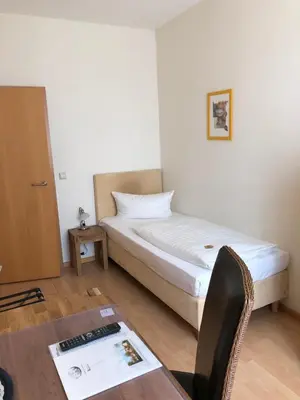 Ein Bett oder Betten in einem Zimmer der Unterkunft Hotel im Kavalierhaus