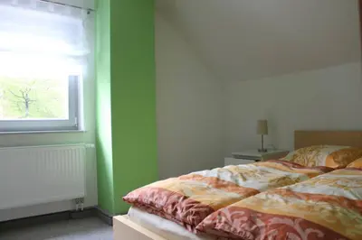 Ein Bett oder Betten in einem Zimmer der Unterkunft Haus Elbblick