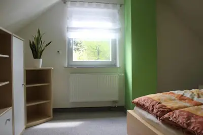 Ein Bett oder Betten in einem Zimmer der Unterkunft Haus Elbblick